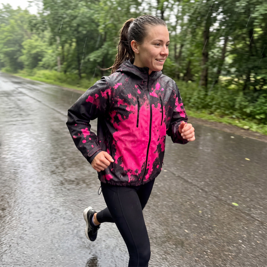 Runner in the Pink RainRunner jacket on a wet park road